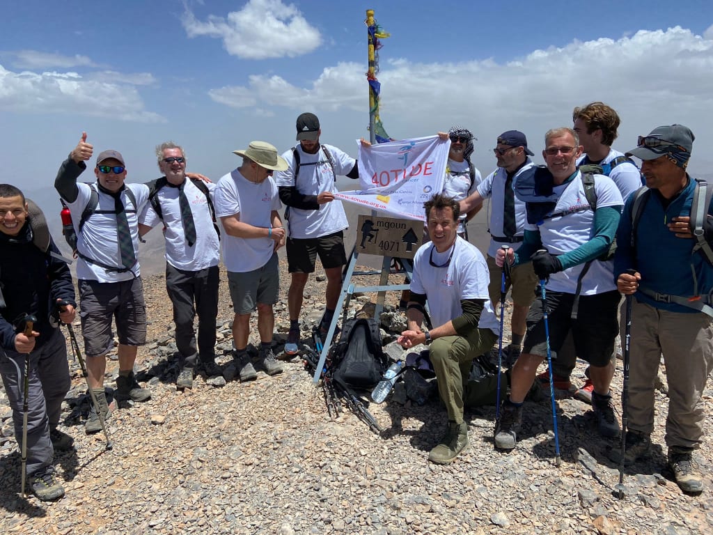 40tuders at the summit of Mt MGoun