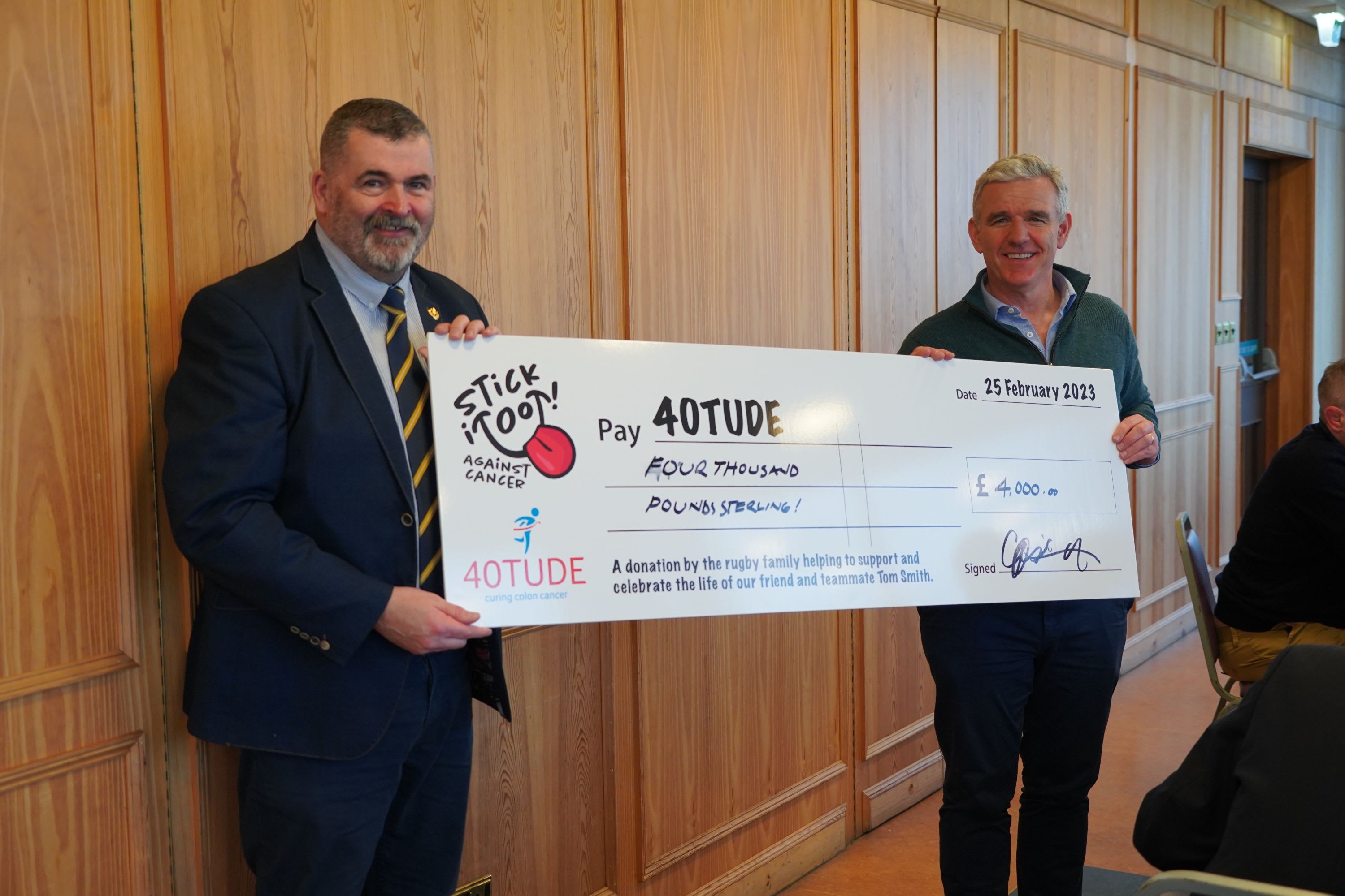Pictured: Billy Gartley, VP of Dundee Rugby Club presents a cheque to 40tude team member Gordon Peterson