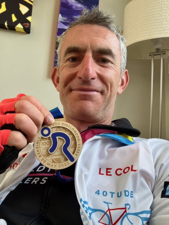 Stuart Storey shows off his 2023 RideLondon 100 medal